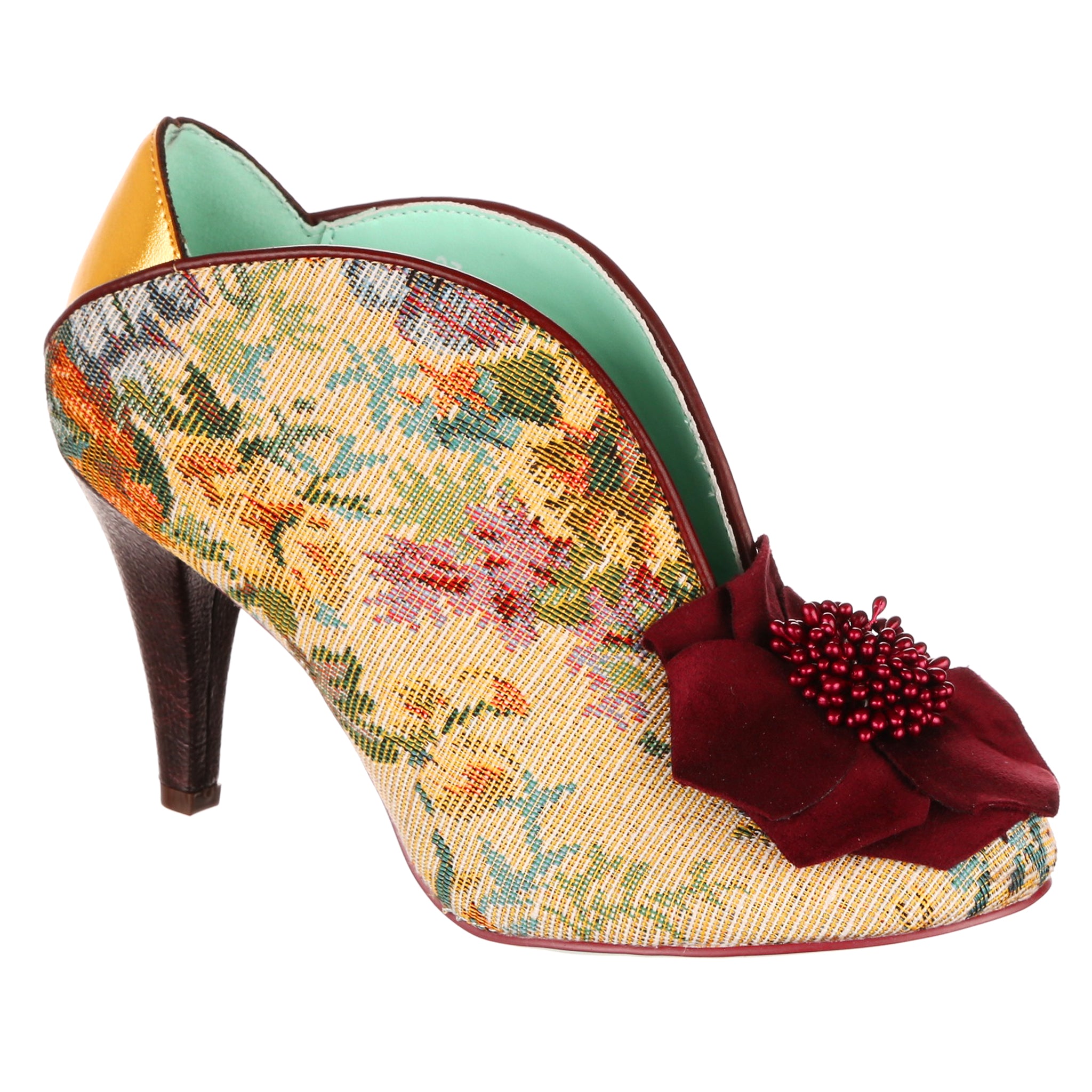 High-heeled shoe with floral tapestry pattern and red flower detail on the toe on a white background