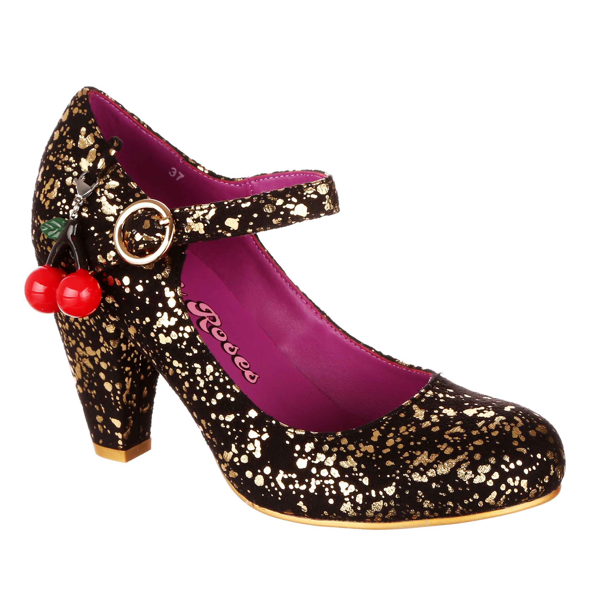 Black gold flecked high-heeled shoe with red cherry charm, ankle strap and gold buckle on a white background