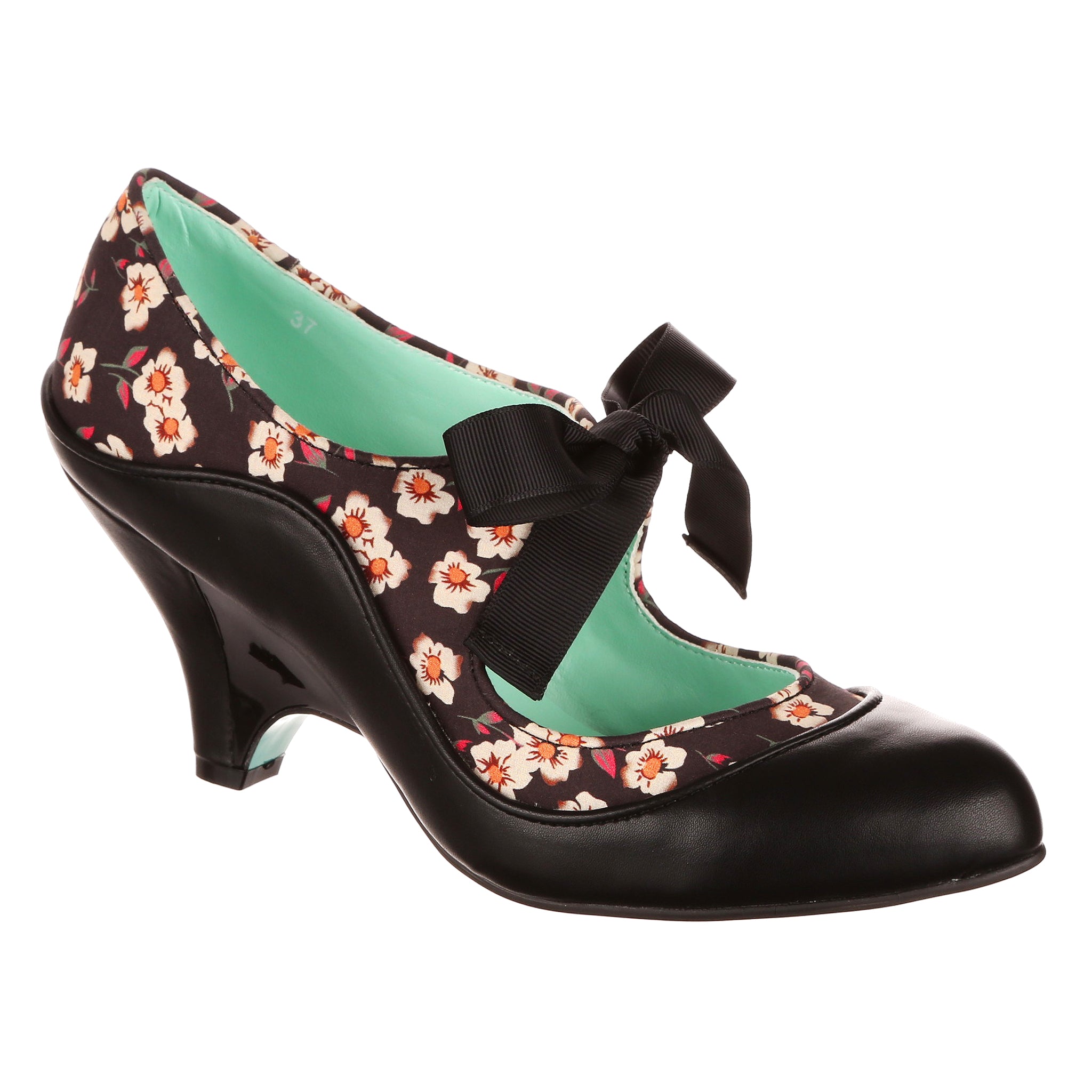 Black floral-patterned mid heeled shoe with a black ankle tie bow on the front on a white background