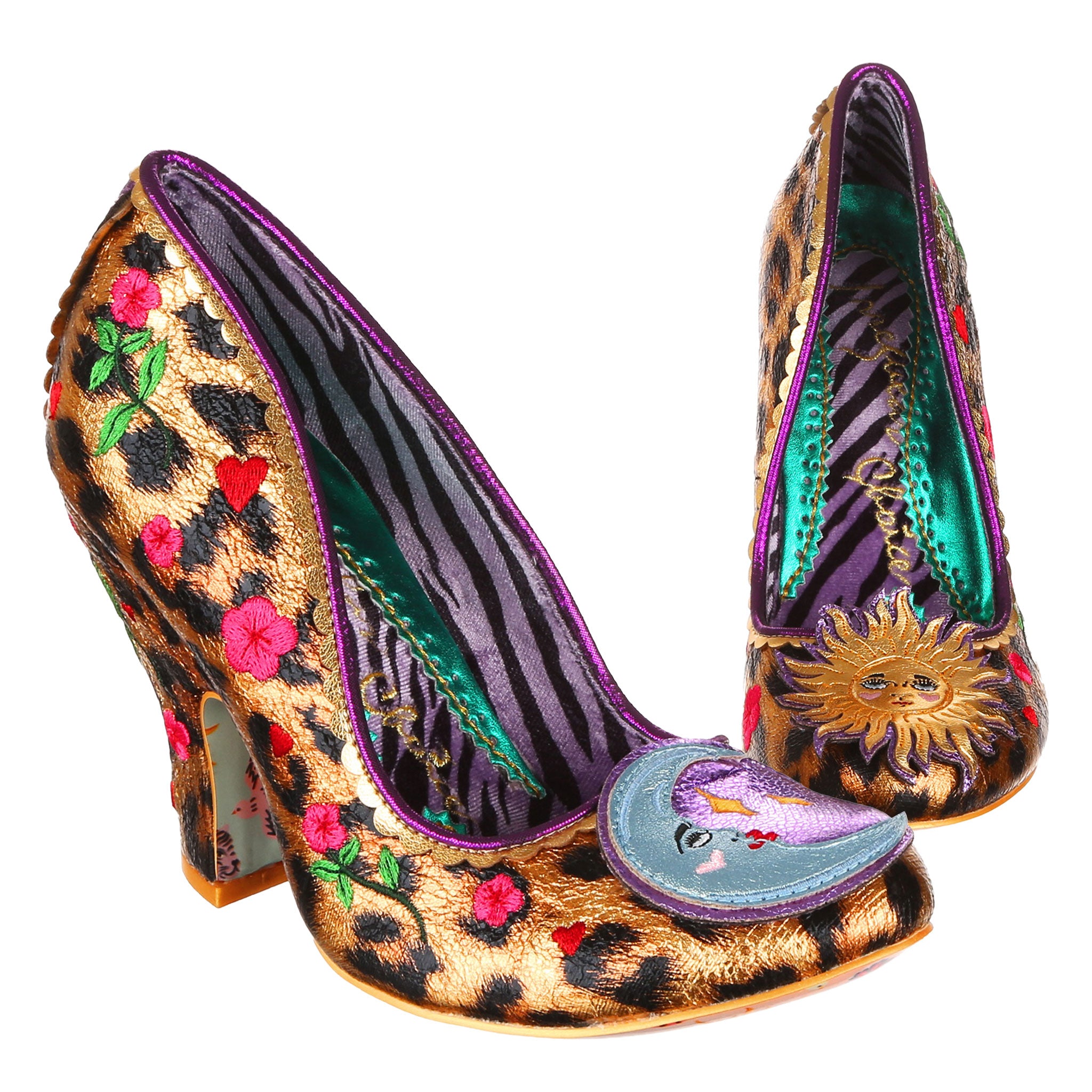 Shiny metallic leopard print slip on high heels with embroidered details up the sides, a purple tiger print lining and a sun and moon motif on the toe on a white background.