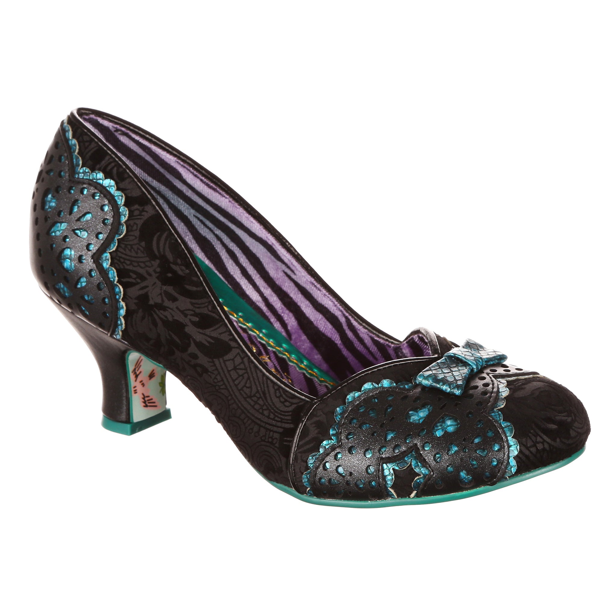 Black lace print slip on mid heeled shoes with blue decorative details and mini blue bow on the toe on a white background.