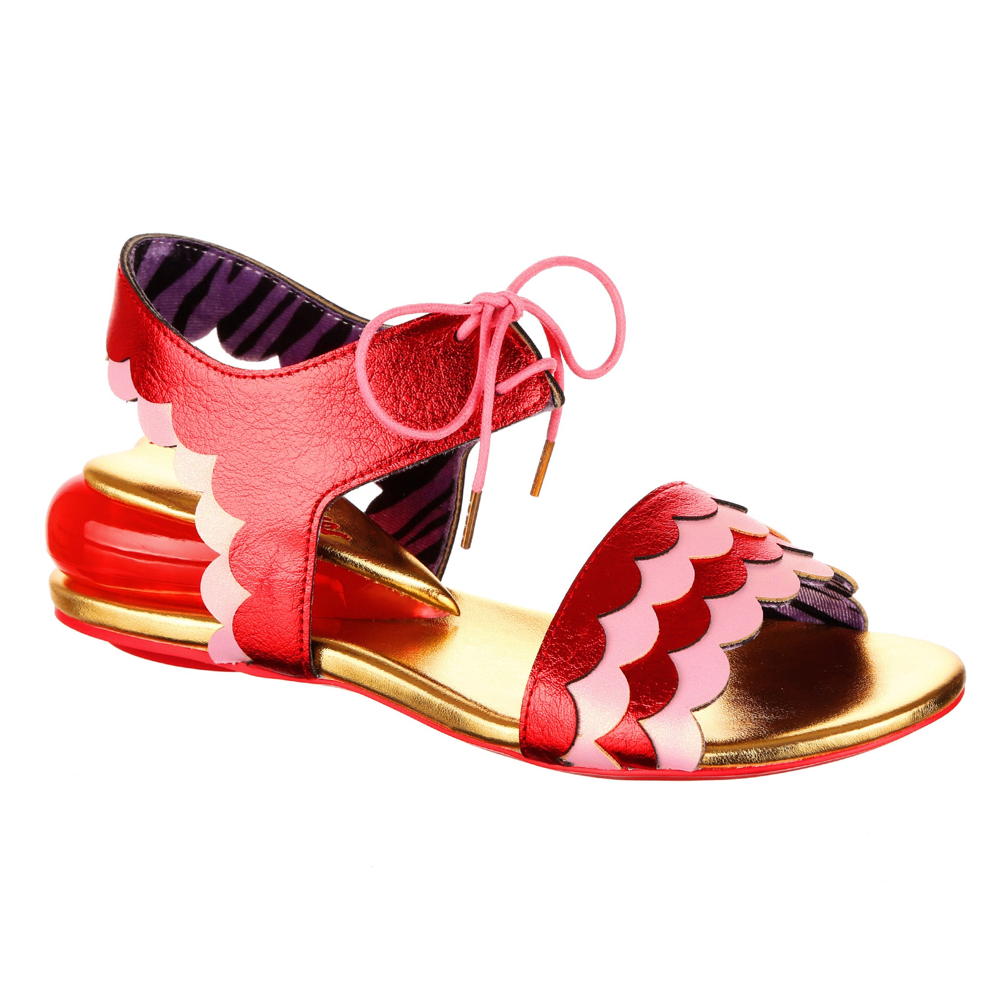 Red pink and gold sandal with low wedge heel in the shape of a heart, with scalloped details and a lace up ankle strap.