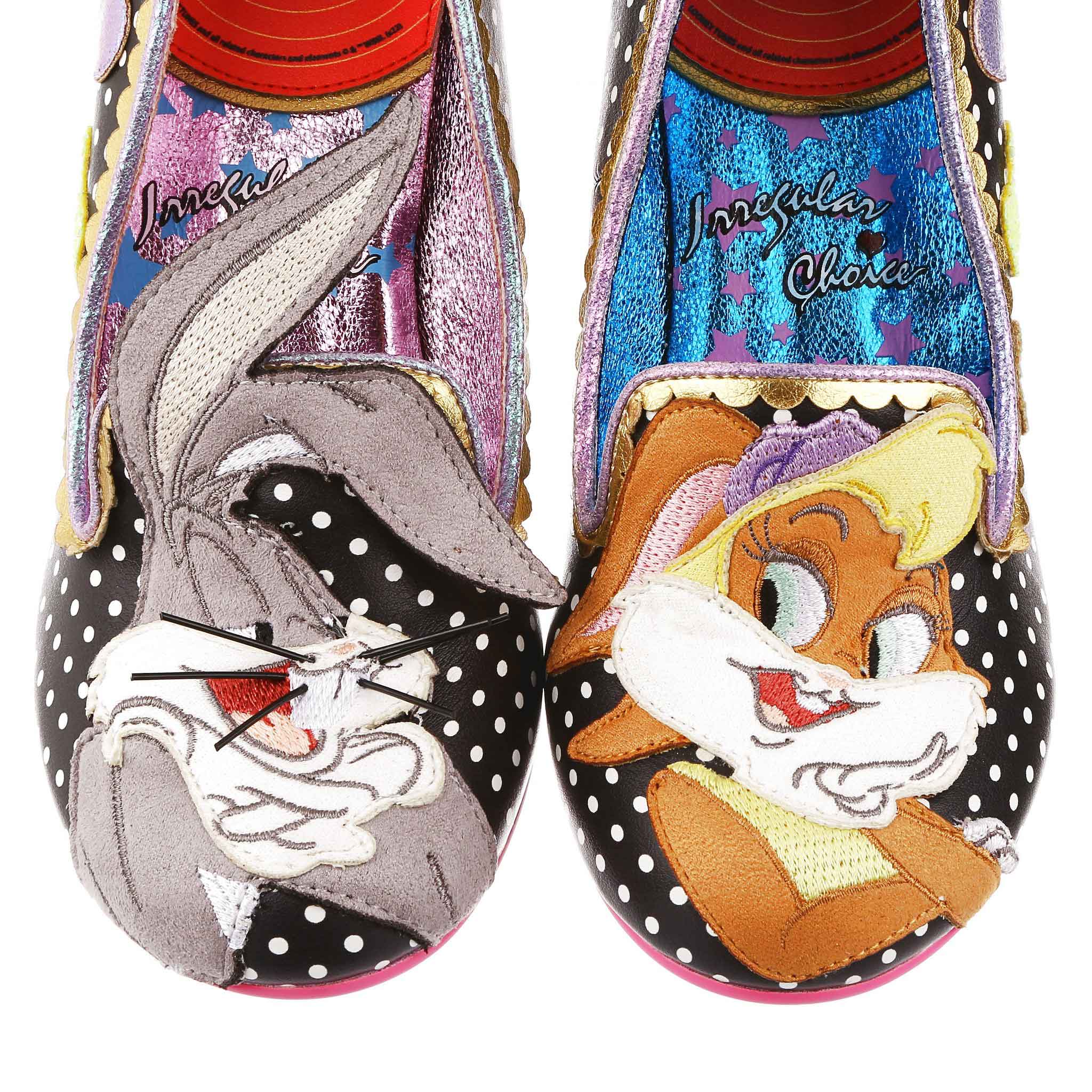 A black and white polka dot with pastel glitter hearts, gold scalloping and Bugs Bunny appliqued on the right toe and Lola Bunny on the left toe.
