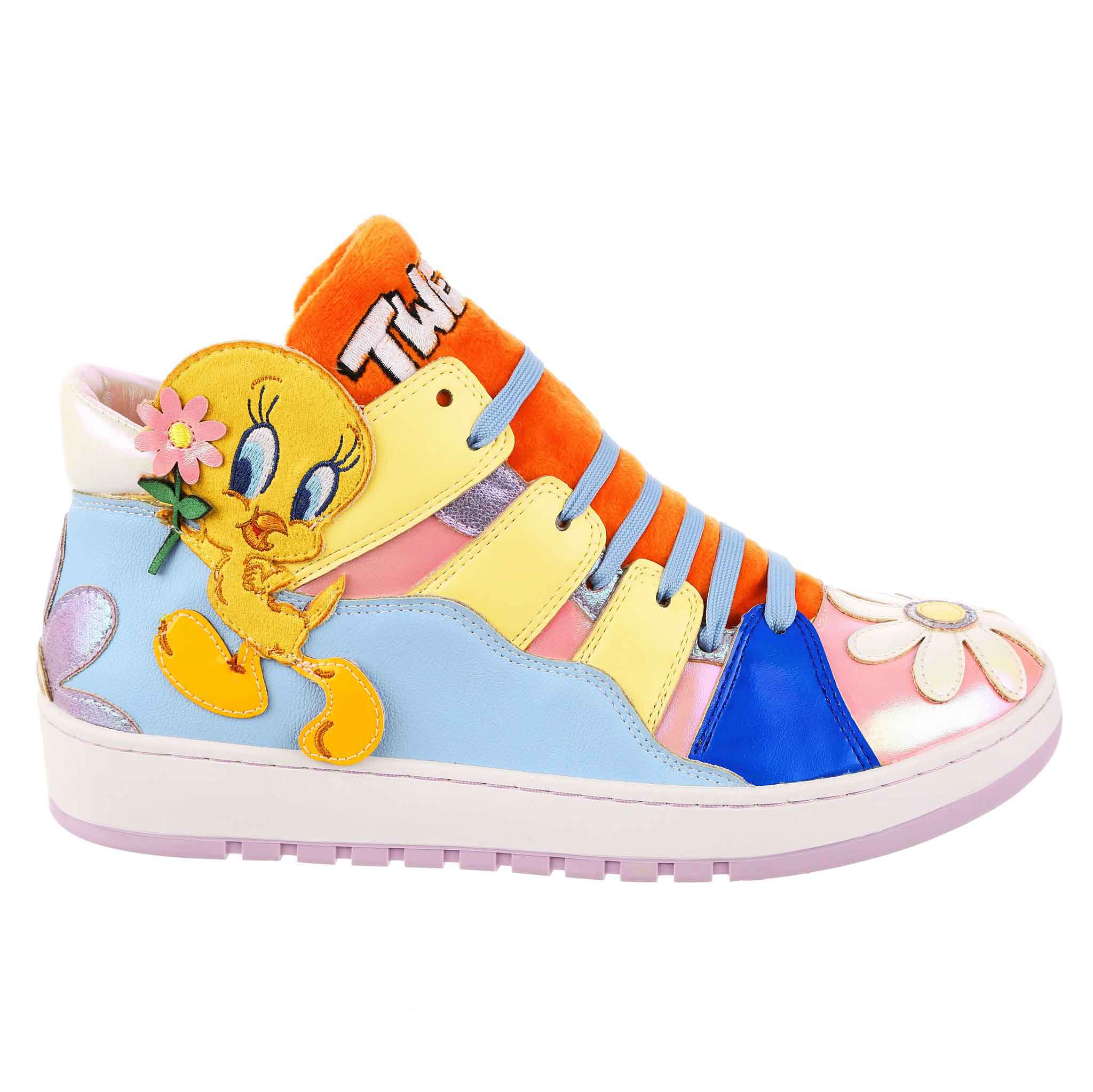 Pastel trainers with iridescent pink fabric and shiny flowers are contrasted with a fluffy orange tongue embroidered with the word Tweety in white. Along a wavy blue panel on the side is an applique of Tweety Bird himself holding a flower.