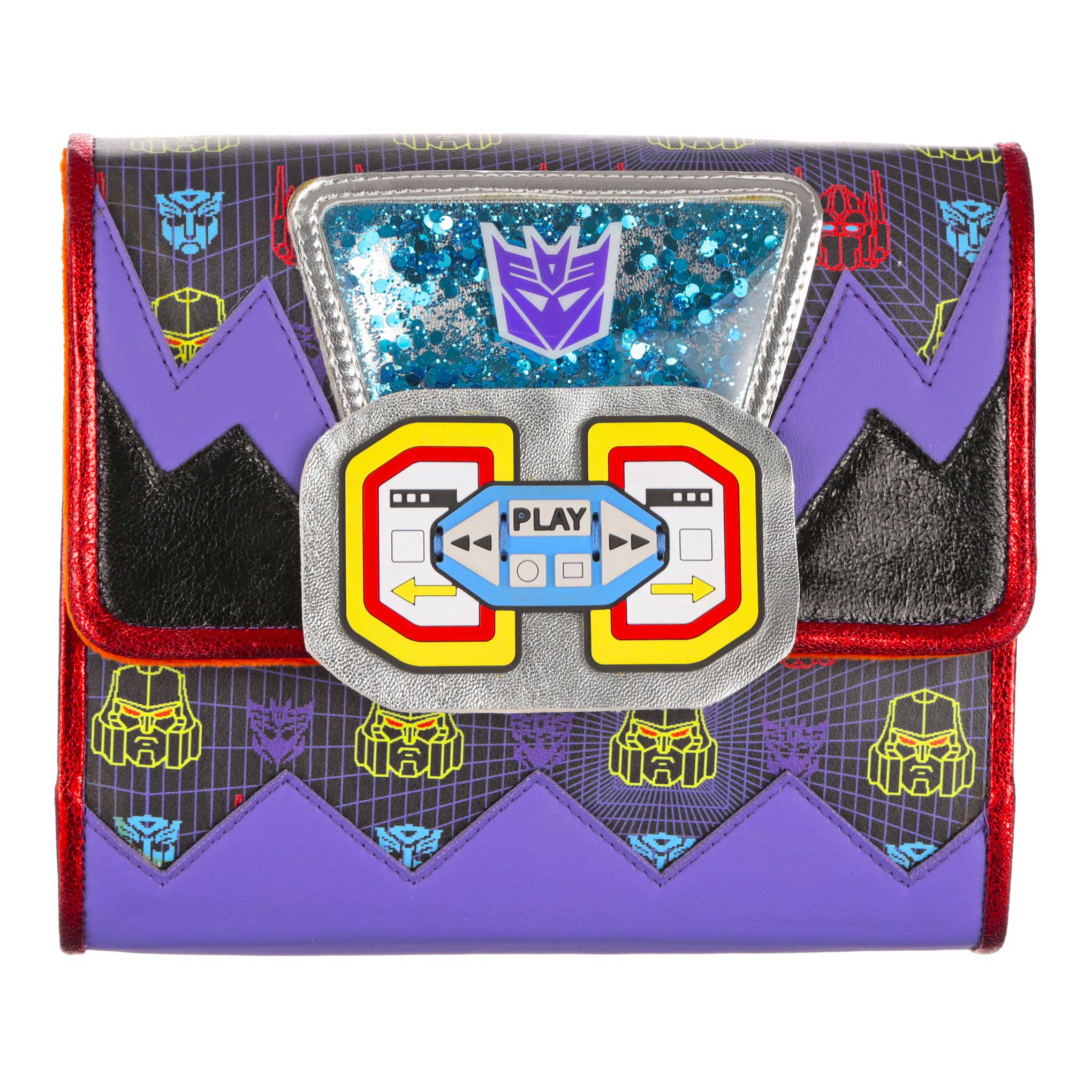 A Transformers themed handbag with retro 80’s cassette tape logo on the front tab. A purple Decepticon logo sits at the top of the clutch bag with blue sparkly metallic background. Chunky purple zigzag details and a black geometric pixal art print covers all over the body of this small Transformers bag. Finished off with red metallic piping. 