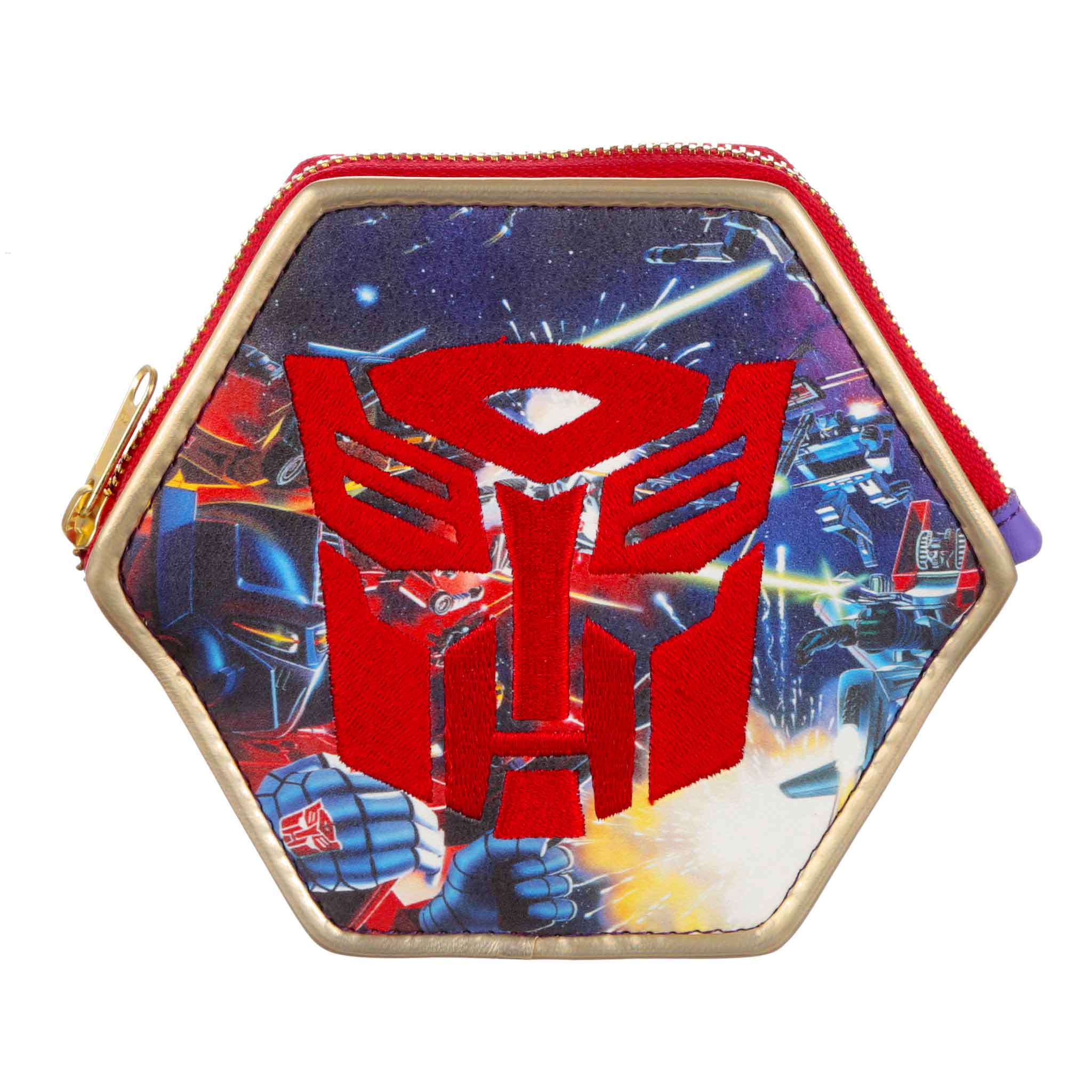 A Transformers-themed small coin purse with gold piping in a hexagon shape. A red and gold zip runs along the top of the purse whilst a blue retro Transformers print covers the purse.  A large red Autobot logo is embroidered onto the side of the purse.  